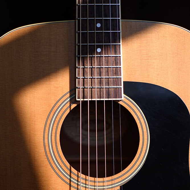 Closeup of acoustic guitar, photo by Jacek Dylag