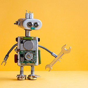 Photograph of a toy robot with a wrench