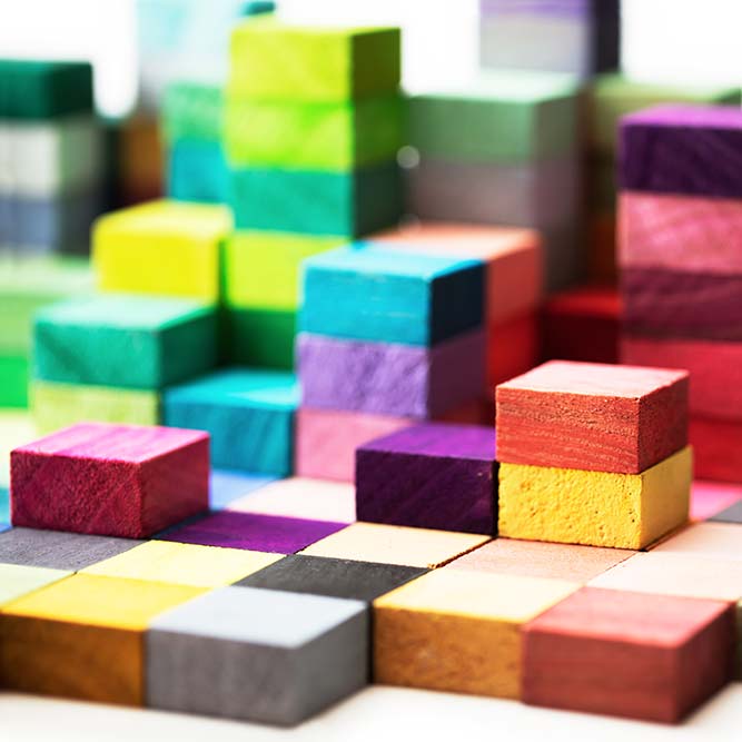 Colorful blocks stacked to create towers of different sizes